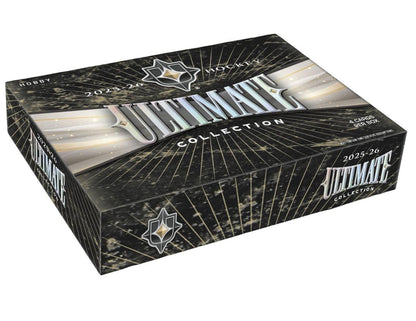 2025/26 Upper Deck Ultimate Collection Hockey Hobby Box featuring Ultimate Rookie cards, premium autographs, and jumbo shield patches.
Back of the 2025/26 Upper Deck Ultimate Collection Hockey Hobby Box showing product information and premium rookie content.
2025/26 Upper Deck Ultimate Collection Hockey premium trading card pack artwork.
2025/26 Upper Deck Ultimate Collection Hockey promotional sell sheet highlighting Ultimate Rookie Auto Patch cards, Jumbo Shield Patches, Rookie Tandem Shield Patches, and 